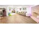 Finished basement with lounge area, fireplace, and open layout at 4554 Meadow Valley Dr, Atlanta, GA 30342