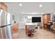 Basement featuring a stainless steel refrigerator, island, and built-in cabinetry at 4554 Meadow Valley Dr, Atlanta, GA 30342