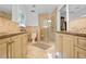 Bathroom featuring double sinks, walk-in shower with glass surround, and neutral tiles at 4554 Meadow Valley Dr, Atlanta, GA 30342