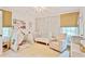 Bright Bedroom with play tent, crib, rocking chair, and ample natural light at 4554 Meadow Valley Dr, Atlanta, GA 30342