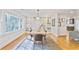 Bright dining room featuring hardwood floors, built-in shelving, and backyard views at 4554 Meadow Valley Dr, Atlanta, GA 30342
