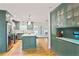 Stylish kitchen with green cabinetry, stainless steel appliances, and a large center island at 4554 Meadow Valley Dr, Atlanta, GA 30342