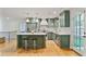 Modern kitchen featuring green cabinets, stainless steel appliances, and a center island at 4554 Meadow Valley Dr, Atlanta, GA 30342