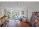 Bright room features whitewashed brick walls, tiled floor, and a built-in breakfast nook with a view of the yard at 4554 Meadow Valley Dr, Atlanta, GA 30342