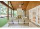 Relaxing screened-in patio with a stone fireplace and comfortable seating at 4554 Meadow Valley Dr, Atlanta, GA 30342