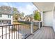 View of the surrounding neighborhood from a private balcony with black metal railings and covered ceiling at 490 Hammons Way, Atlanta, GA 30315