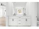 Modern bathroom with double vanity, white cabinets, and sleek black hardware at 490 Hammons Way, Atlanta, GA 30315