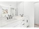 Modern bathroom features double vanity, white cabinets, and black hardware at 490 Hammons Way, Atlanta, GA 30315