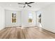 Bright bedroom with hardwood floors, a ceiling fan, and several windows at 490 Hammons Way, Atlanta, GA 30315