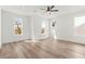 Bright bedroom features hardwood floors, three windows, and a ceiling fan at 490 Hammons Way, Atlanta, GA 30315