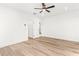 Bright bedroom features hardwood floors, ceiling fan, and ensuite bathroom access at 490 Hammons Way, Atlanta, GA 30315