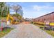 Construction site with heavy machinery, trail closure signs, and new brick building at 490 Hammons Way, Atlanta, GA 30315