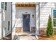 Inviting front entrance showcases a stylish door, stone accents, and manicured shrubbery for a welcoming curb appeal at 490 Hammons Way, Atlanta, GA 30315