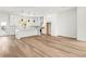 Open-concept kitchen boasts white cabinets, an island, and modern stainless steel appliances, perfect for entertaining at 490 Hammons Way, Atlanta, GA 30315