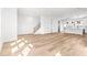 Spacious open-concept living room with hardwood floors and bright natural light at 490 Hammons Way, Atlanta, GA 30315