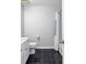 Bathroom featuring black tiled floors, white walls, and a shower with a white curtain at 1500 Tara Pl # 810, Hampton, GA 30228