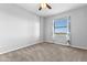 Bedroom with neutral walls, carpet flooring, ceiling fan and a view from the window at 1500 Tara Pl # 810, Hampton, GA 30228