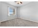 Bright bedroom featuring carpeted floors and a large window at 1500 Tara Pl # 810, Hampton, GA 30228