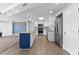 Modern kitchen featuring a blue island, stainless appliances, and bar seating area at 1500 Tara Pl # 810, Hampton, GA 30228