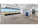 Open living room and kitchen with amazing views from the wall of windows at 1500 Tara Pl # 810, Hampton, GA 30228