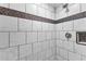 Bathroom shower featuring custom tile and a built-in soap niche at 1500 Tara Pl # 810, Hampton, GA 30228