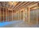 Unfinished basement with framed walls and exposed ceiling with insulation at 31 Cedar Gate Ln, Kingston, GA 30145