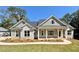 Charming single-Gathering home with stone accents, covered porch, and freshly landscaped front yard at 31 Cedar Gate Ln, Kingston, GA 30145