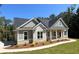 Beautiful house with a manicured lawn and inviting front porch with stone and siding accents at 31 Cedar Gate Ln, Kingston, GA 30145