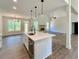 Bright kitchen featuring a center island, stainless steel appliances, and open floor plan at 31 Cedar Gate Ln, Kingston, GA 30145