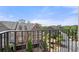 Balcony view with lovely neighborhood homes, green spaces, and blue skies at 705 Abbington River Ln, Atlanta, GA 30339