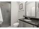 Elegant bathroom featuring a glass-enclosed shower and modern vanity at 705 Abbington River Ln, Atlanta, GA 30339