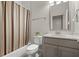 Well-lit bathroom with a shower-tub combination and vanity at 705 Abbington River Ln, Atlanta, GA 30339