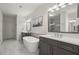 Bright bathroom features double vanity, soaking tub, walk-in shower, and neutral-toned flooring for a sleek look at 705 Abbington River Ln, Atlanta, GA 30339