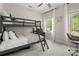 Charming bedroom with bunk beds and bright, natural light at 705 Abbington River Ln, Atlanta, GA 30339