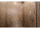 Interior shot of the elevator featuring wood paneling and easy-to-use button controls at 705 Abbington River Ln, Atlanta, GA 30339