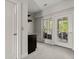 Hallway features a wet bar, full view of the outdoor balcony, and neutral carpeting at 705 Abbington River Ln, Atlanta, GA 30339