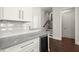 Kitchen featuring a wine refrigerator and white cabinets at 705 Abbington River Ln, Atlanta, GA 30339