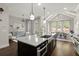 Large kitchen featuring a large island with bar stool seating and stainless steel appliances at 705 Abbington River Ln, Atlanta, GA 30339