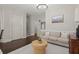 Comfortable living room featuring neutral color palette, modern lighting, and hardwood flooring at 705 Abbington River Ln, Atlanta, GA 30339