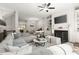 Spacious living room with cozy seating arrangement, fireplace, built-in shelves, and open floor plan at 705 Abbington River Ln, Atlanta, GA 30339