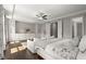 Spacious main bedroom features hardwood floors, built-in storage, and a seating area with a luxury aesthetic at 705 Abbington River Ln, Atlanta, GA 30339