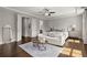 Large primary bedroom with an ensuite, sitting area, and ample natural light at 705 Abbington River Ln, Atlanta, GA 30339