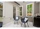 Charming patio with grill, stylish seating, and views of the surrounding foliage at 705 Abbington River Ln, Atlanta, GA 30339