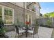Cozy patio with a round table and chairs, perfect for outdoor entertaining and relaxation at 705 Abbington River Ln, Atlanta, GA 30339