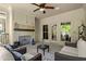 Inviting sunroom with a brick fireplace and comfortable seating, creating a cozy atmosphere at 705 Abbington River Ln, Atlanta, GA 30339
