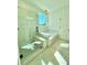 Modern bathroom featuring a glass-enclosed shower and a separate soaking tub by a window at 719 Crossroad Ct, Powder Springs, GA 30127