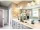 Bright bathroom featuring a double vanity, large mirror, and modern fixtures at 719 Crossroad Ct, Powder Springs, GA 30127