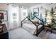 Woodland themed bedroom with decor, featuring a custom-built bed frame and natural lighting at 719 Crossroad Ct, Powder Springs, GA 30127