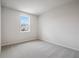 Cozy bedroom with plush carpet and natural light from the window at 719 Crossroad Ct, Powder Springs, GA 30127