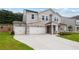 Charming two-story home with stone accents, a three-car garage and well-manicured front lawn at 719 Crossroad Ct, Powder Springs, GA 30127